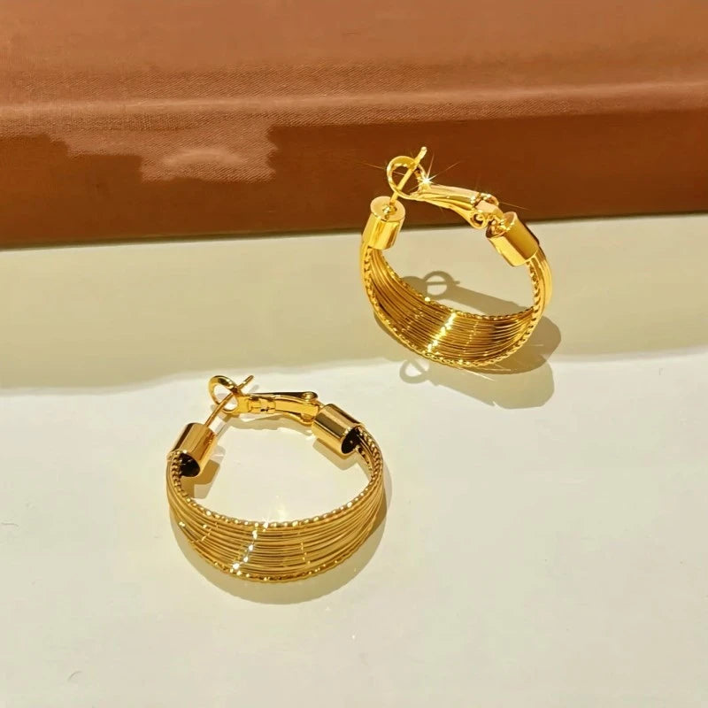 Angled view of the 14K Gold-Plated Wire Wrapped Earrings