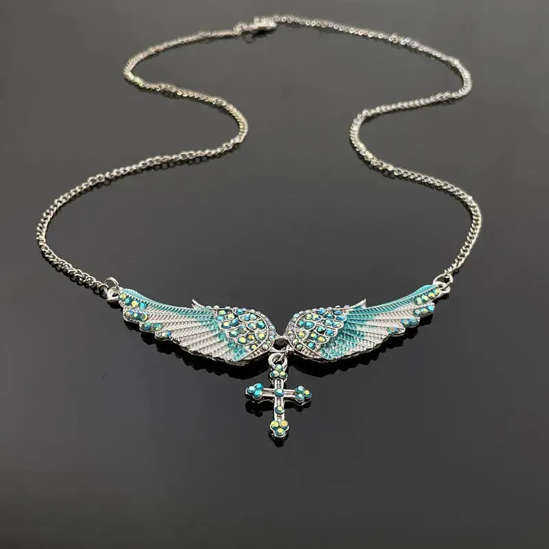 Detailed view of the 14K Gold-Plated Zircon Angel Wing Cross Tassel Necklace chain and pendant