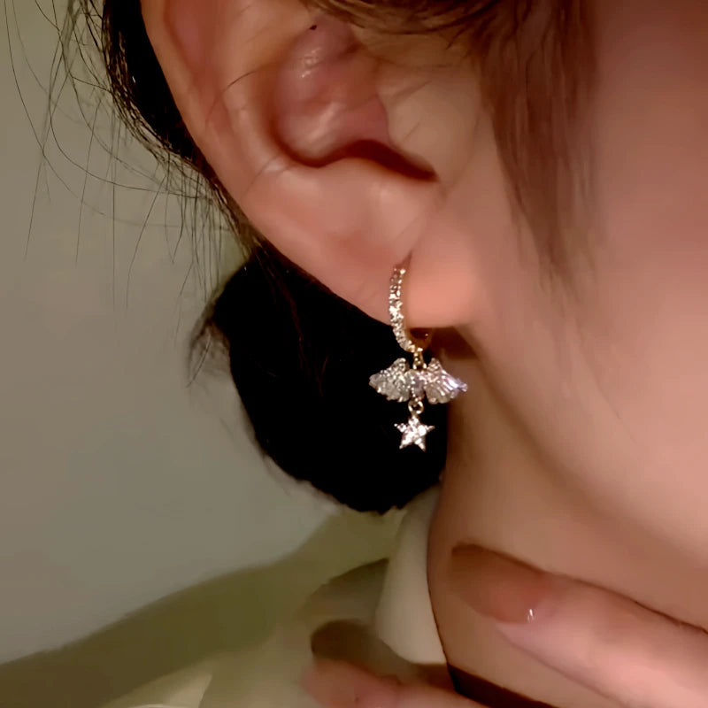 Close-up detail of the sparkling zircons and plating on the Angel Wing Earrings
