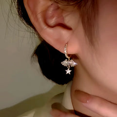 Close-up detail of the sparkling zircons and plating on the Angel Wing Earrings