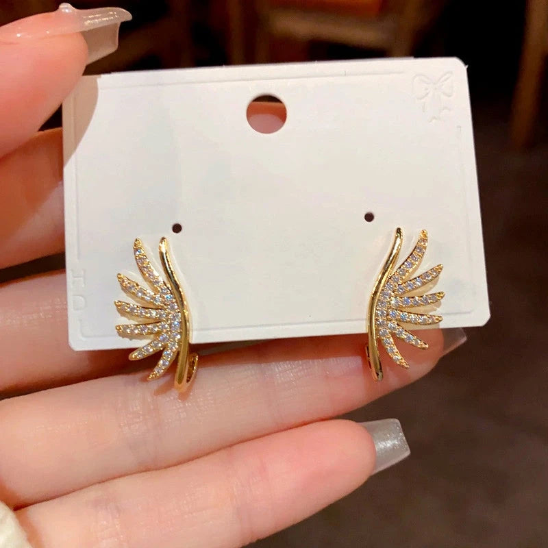 Close-up detail of the sparkling zircons and plating on the Angel Wing Earrings