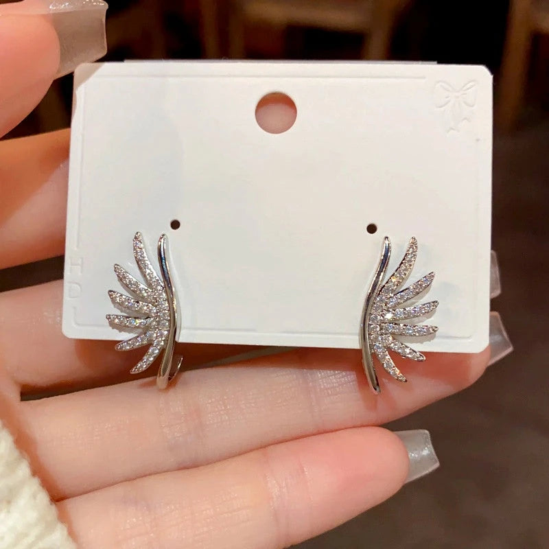 Angled view of the 14K Gold-Plated Zircon Angel Wings Earrings