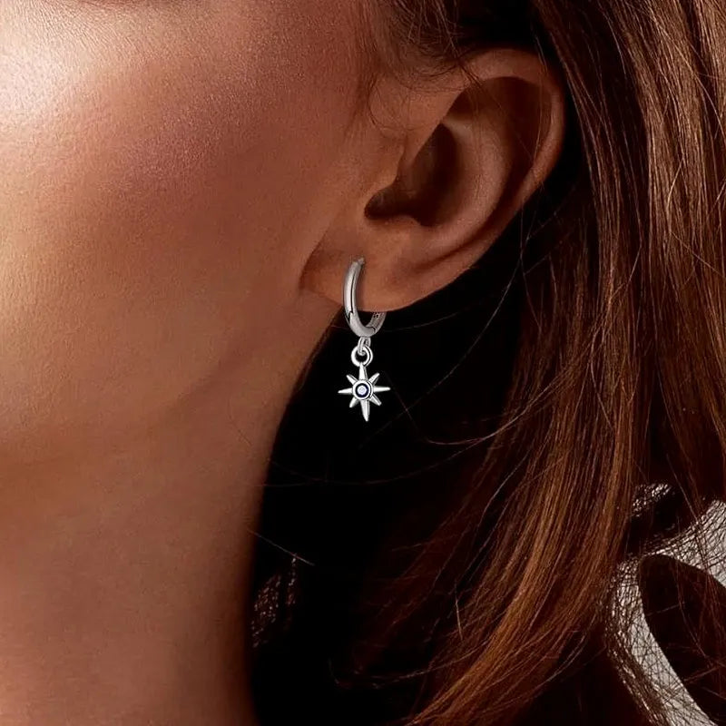 Angled view of the 14K Gold-Plated Zircon Asymmetrical Star Sun Earrings
