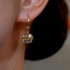 Close-up detail of the sparkling zircons and plating on the Zircon Ball Earrings