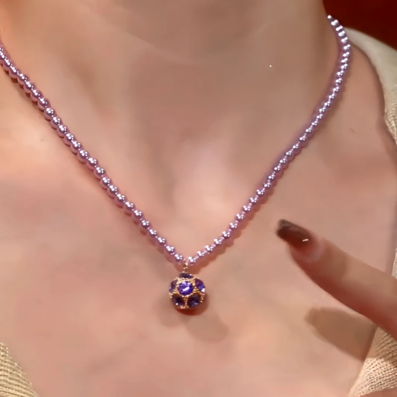 Close-up of the pendant and clasp on the Pearl Necklace
