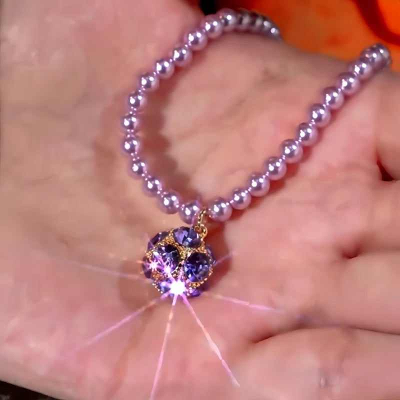 Detailed view of the 14K Gold-Plated Zircon Ball Pearl Necklace chain and pendant