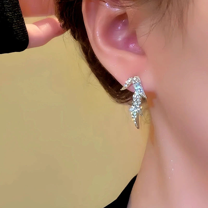 Model showcasing the dangle and style of the 14K Gold-Plated Zircon Bamboo Leaf Earrings