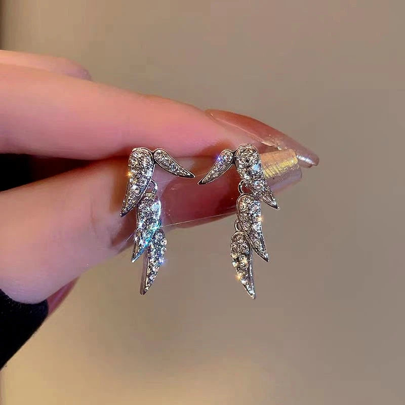 Angled view of the 14K Gold-Plated Zircon Bamboo Leaf Earrings