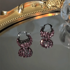 Close-up detail of the sparkling zircons and plating on the Basket Earrings