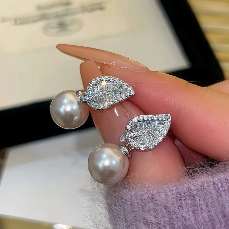 Close-up detail of the sparkling zircons and plating on the Leaf Jacket Earrings
