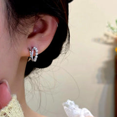 Model showcasing the dangle and style of the 14K Gold-Plated Zircon Bead Multi-layer Stud Earrings