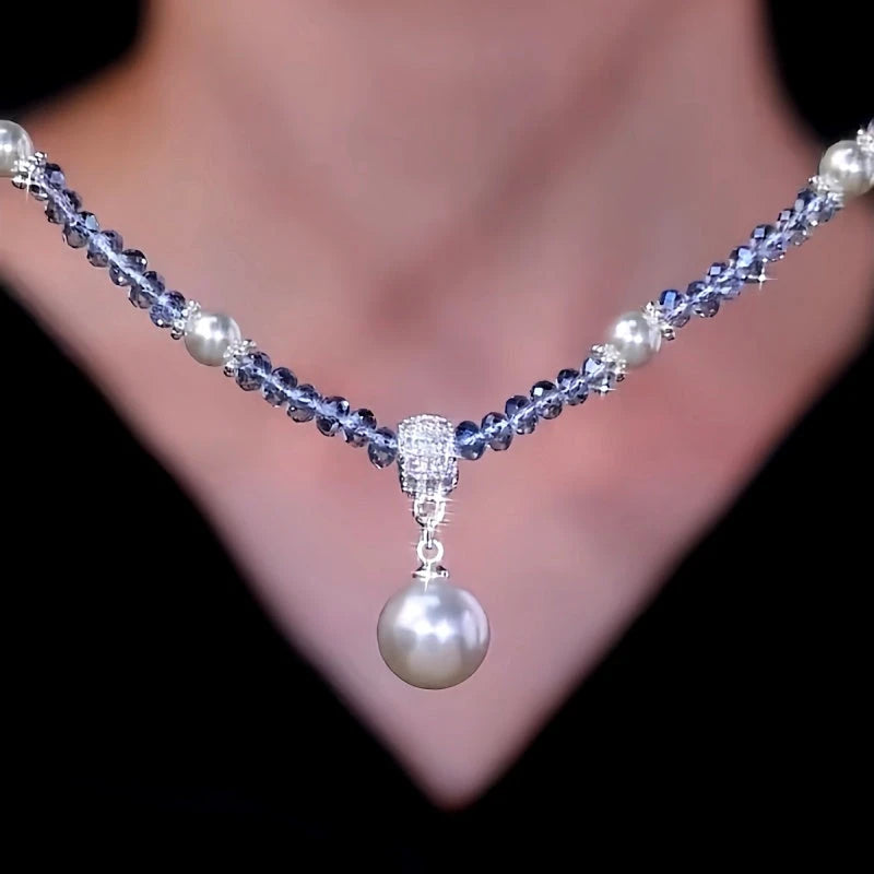 Detailed view of the 14K Gold-Plated Zircon Bead Pearl Pendant Necklace chain and pendant
