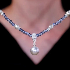 Detailed view of the 14K Gold-Plated Zircon Bead Pearl Pendant Necklace chain and pendant