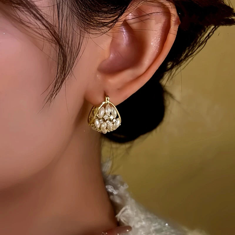 Model showcasing the dangle and style of the 14K Gold-Plated Zircon Beaded Flower Basket Earrings