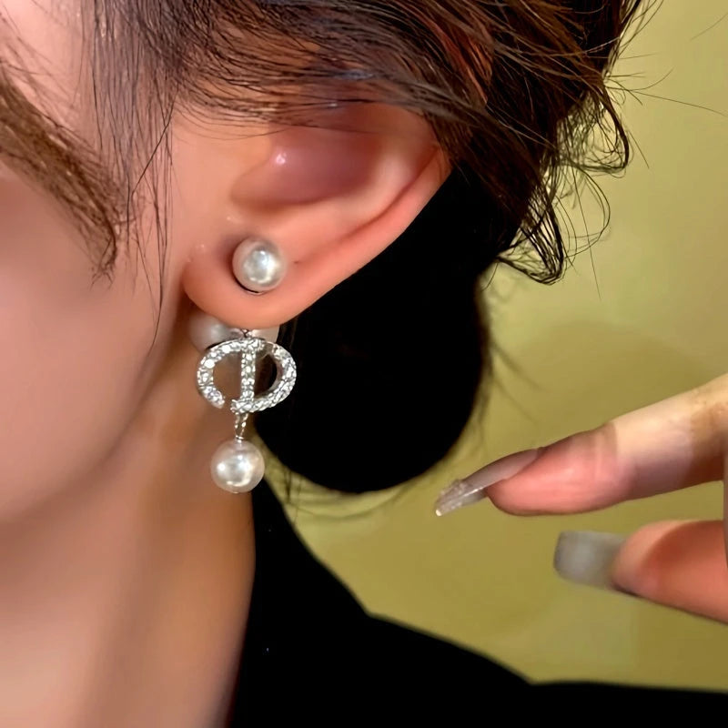 Model showcasing the dangle and style of the 14K Gold-Plated Zircon Beaded Tassel Earrings