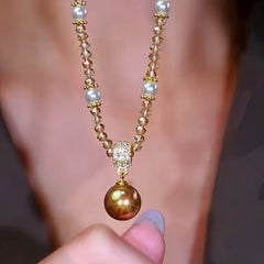 Close-up of the pendant and clasp on the Brown Pearl Necklace