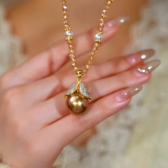 Close-up of the pendant and clasp on the Leaf Bead Necklace