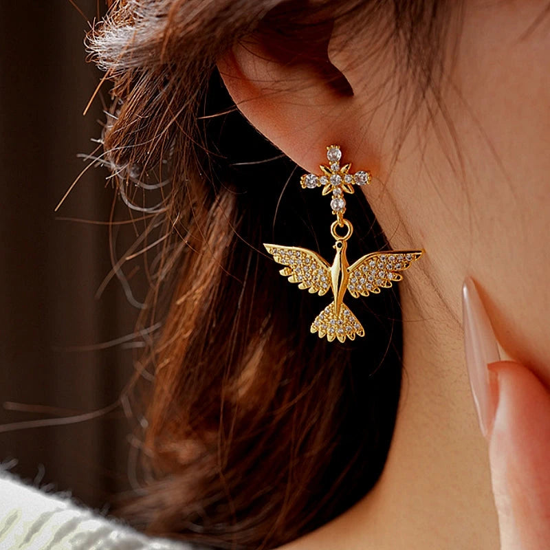 Angled view of the 14K Gold-Plated Zircon Bird Earrings