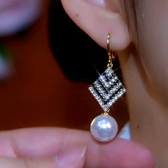 Close-up detail of the sparkling zircons and plating on the Pearl Diamond Earrings