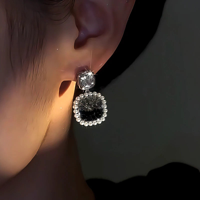 Close-up detail of the sparkling zircons and plating on the Black Crystal Earrings