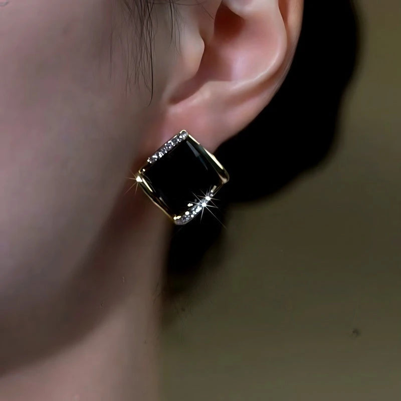 Close-up detail of the sparkling zircons and plating on the Black Stud Earrings