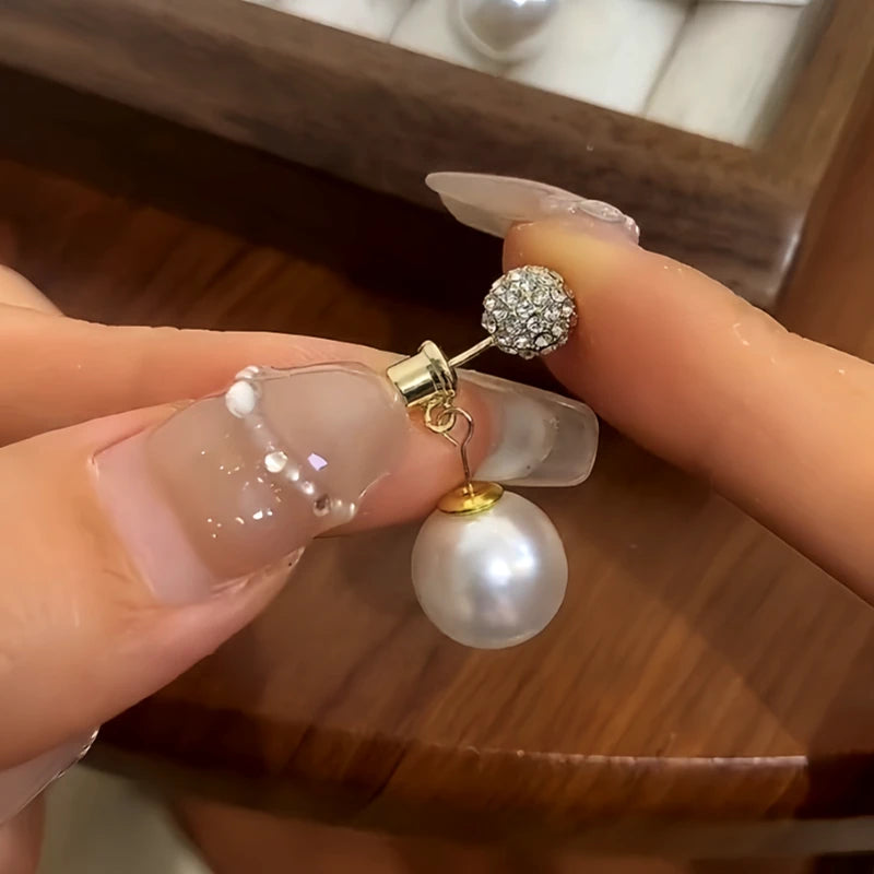 Angled view of the 14K Gold-Plated Zircon Bling Ball Pearl Earrings