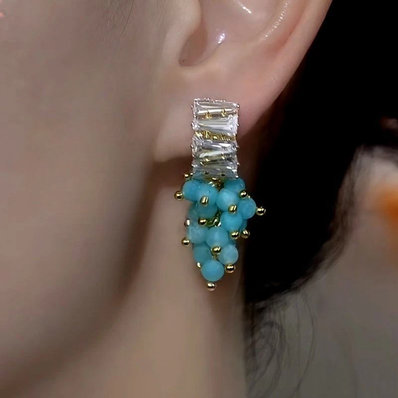 Close-up detail of the sparkling zircons and plating on the Bead Tassel Earrings