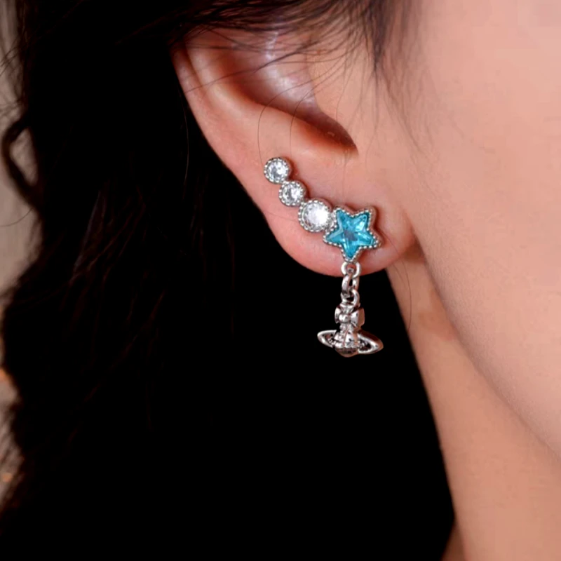 Close-up detail of the sparkling zircons and plating on the Star Tassel Earrings