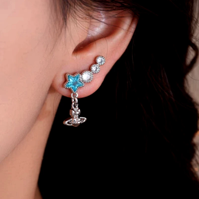 Angled view of the 14K Gold-Plated Zircon Blue Star Tassel Earrings