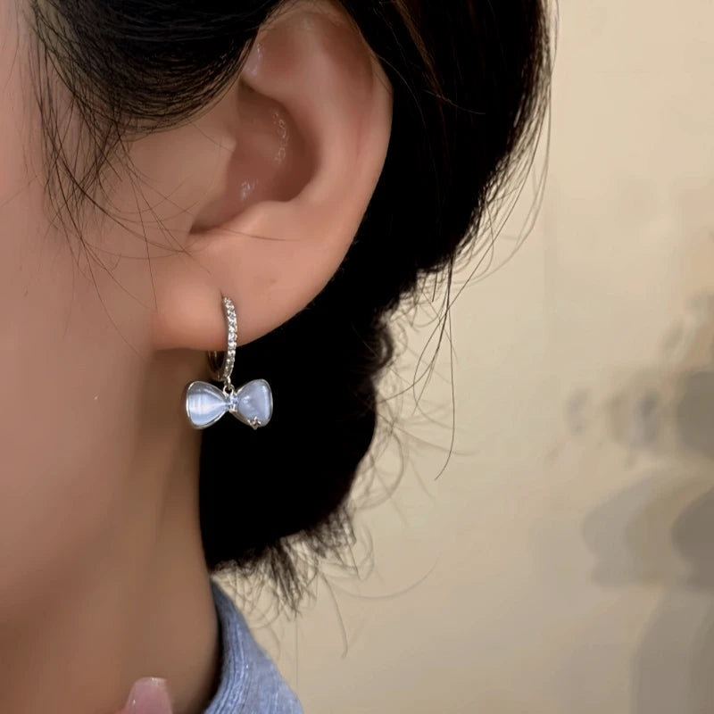 Close-up detail of the sparkling zircons and plating on the Silver Bow Earrings