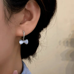 Close-up detail of the sparkling zircons and plating on the Silver Bow Earrings