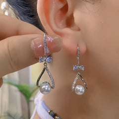 Close-up detail of the sparkling zircons and plating on the Pearl Ear Hooks