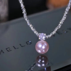 Detailed view of the 14K Gold-Plated Zircon Broken Silver Pearl Necklace chain and pendant