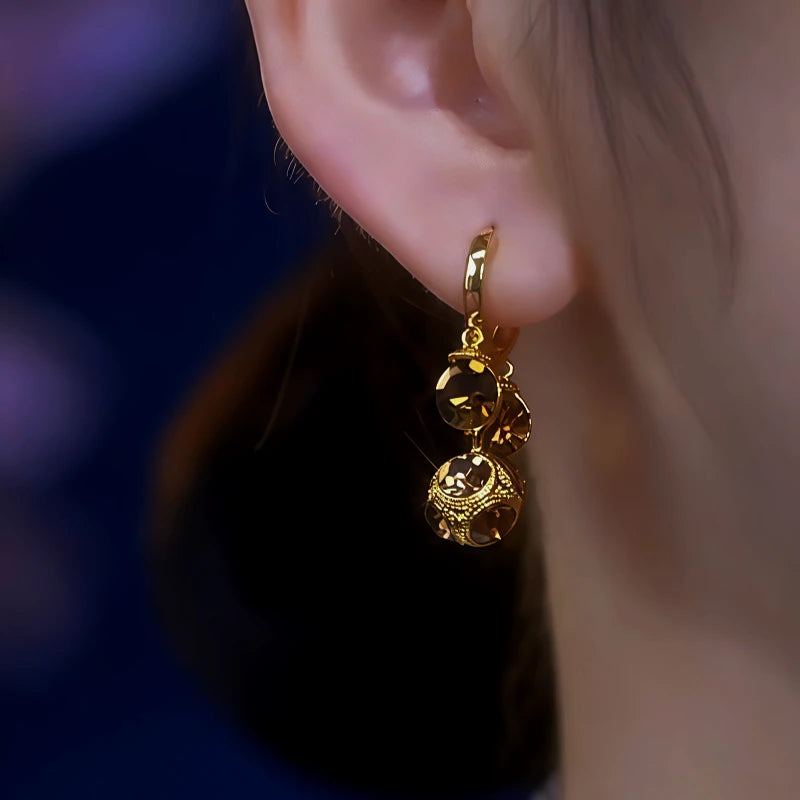 Close-up detail of the sparkling zircons and plating on the Ball Tassel Earrings