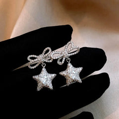 Angled view of the 14K Gold-Plated Zircon Butterfly Bow Star Earrings