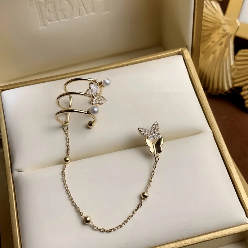 Model showcasing the dangle and style of the 14K Gold-Plated Zircon Butterfly Ear Clip Earrings