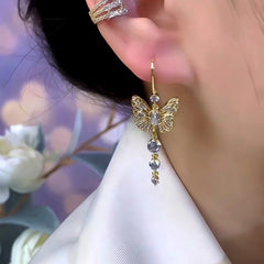 Model showcasing the dangle and style of the 14K Gold-Plated Zircon Butterfly Ear Hook Earrings