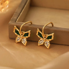 Close-up detail of the sparkling zircons and plating on the Gold Butterfly Earrings