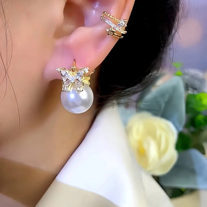 Close-up detail of the sparkling zircons and plating on the Butterfly Pearl Earrings