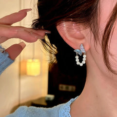 Close-up detail of the sparkling zircons and plating on the Blue Butterfly Earrings