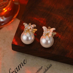 Angled view of the 14K Gold-Plated Zircon Butterfly Pearl Earrings