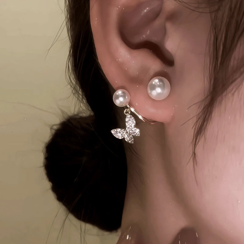 Close-up detail of the sparkling zircons and plating on the Pearl Jacket Earrings