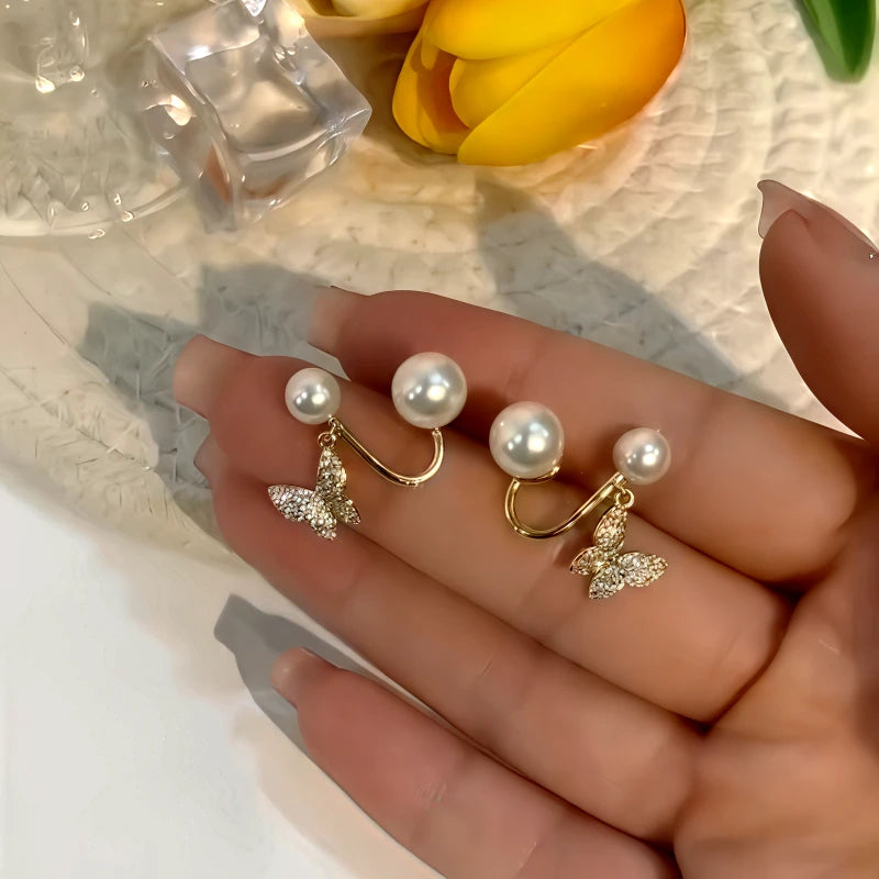 Angled view of the 14K Gold-Plated Zircon Butterfly Pearl Jacket Earrings