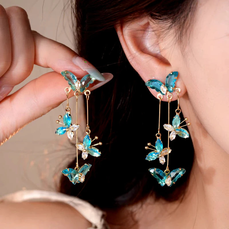 Close-up detail of the sparkling zircons and plating on the Green Tassel Earrings