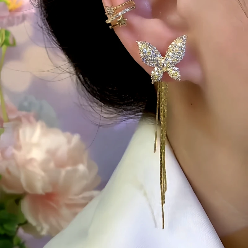 Close-up detail of the sparkling zircons and plating on the Asymmetrical Butterfly Earrings