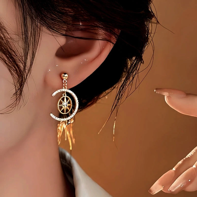 Model showcasing the dangle and style of the 14K Gold-Plated Zircon C-Shaped Star Earrings