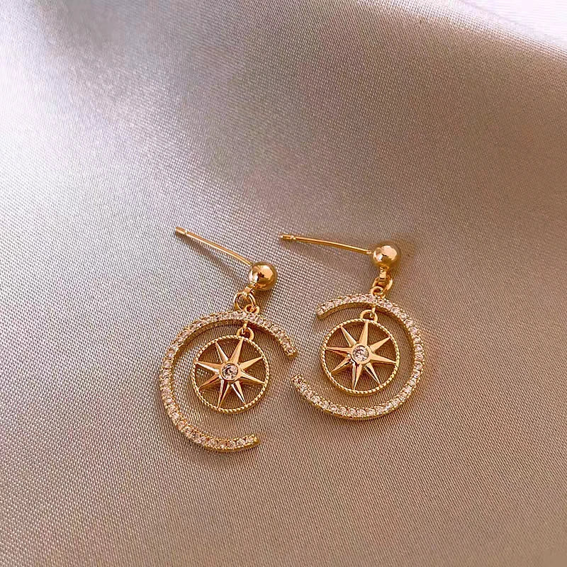 Angled view of the 14K Gold-Plated Zircon C-Shaped Star Earrings