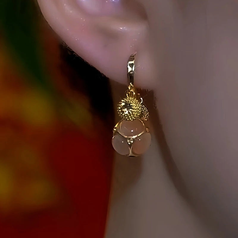 Close-up detail of the sparkling zircons and plating on the Champagne Drop Earrings