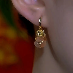 Close-up detail of the sparkling zircons and plating on the Champagne Drop Earrings