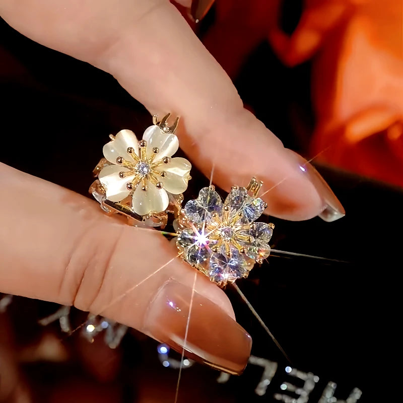 Angled view of the 14K Gold-Plated Zircon Cat's Eye Double-Sided Flower Earrings
